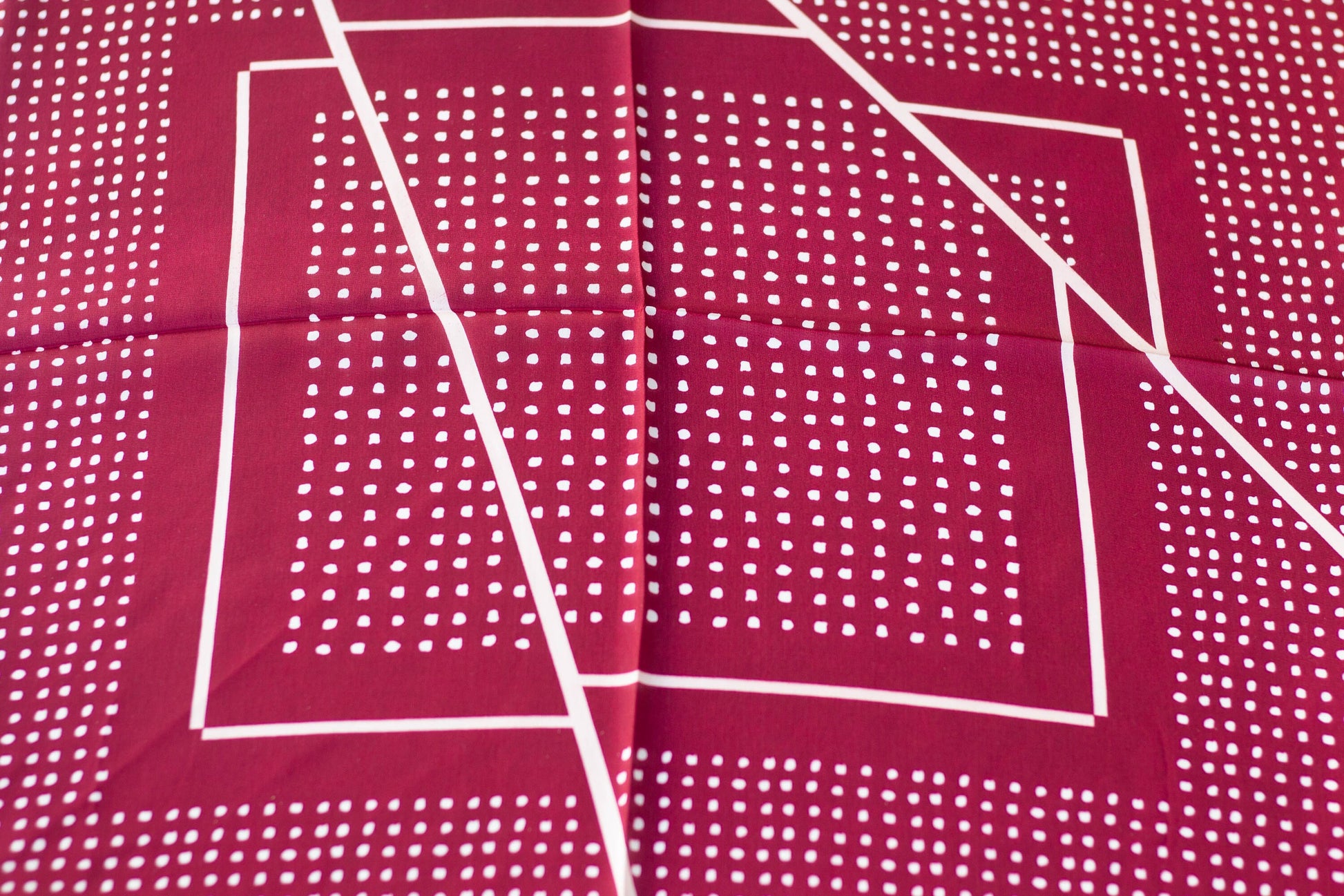 Red satin silk hair scarf with white dot and line details.